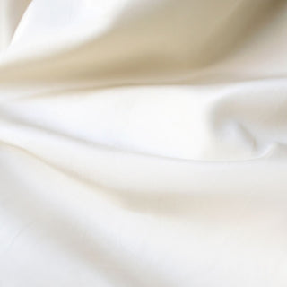 Close-up of smooth, beige fabric texture