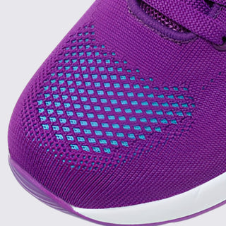 Close-up of a purple sneaker with white sole on a light gray background