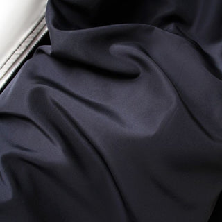 Close-up of dark blue fabric with folds