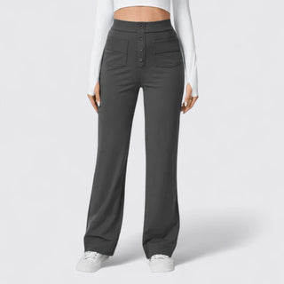 Dark gray wide-leg pants worn by a person on a white background