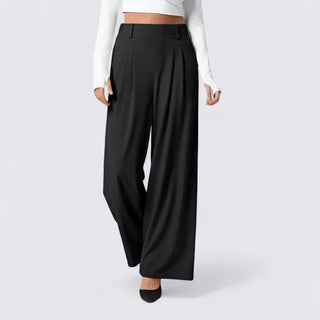 Black wide-leg pants worn by a person on a white background