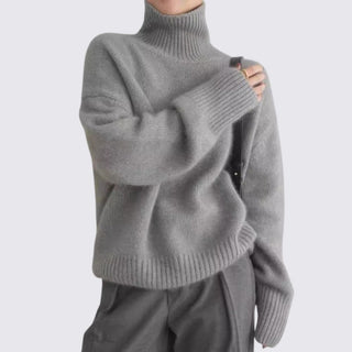 Gray turtleneck sweater with cut-out design on a white background