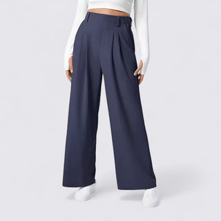 Navy wide-leg pants worn by a person on a white background