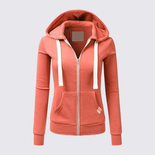 Coral hoodie with a white zipper on a light gray background