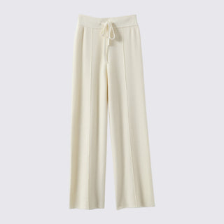 Beige wide-leg pants on a light gray background
