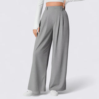 Gray wide-leg pants worn by a person on a white background