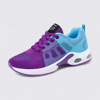 Purple and blue athletic shoe on a light gray background