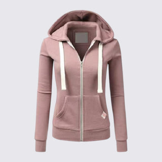 Pink hoodie with white drawstrings on a light gray background
