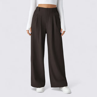 Brown wide-leg pants worn by a person on a white background