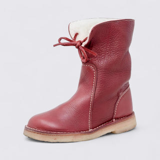 Red leather boot with white lining on a light gray background