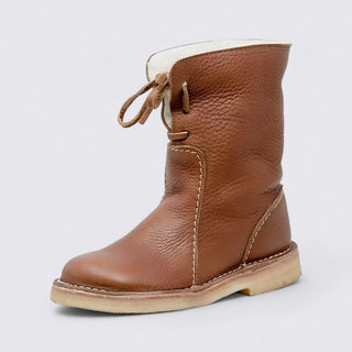 Brown leather boot with white lining on a light gray background