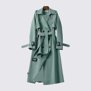 Green trench coat on a light gray background